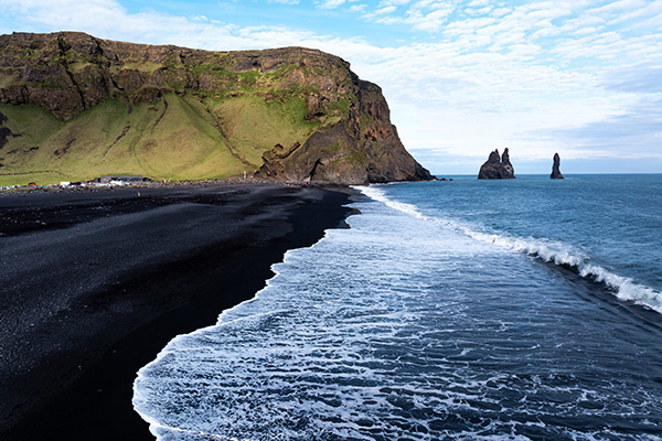 Reynisfjara black sand beach and sea stacks in Iceland